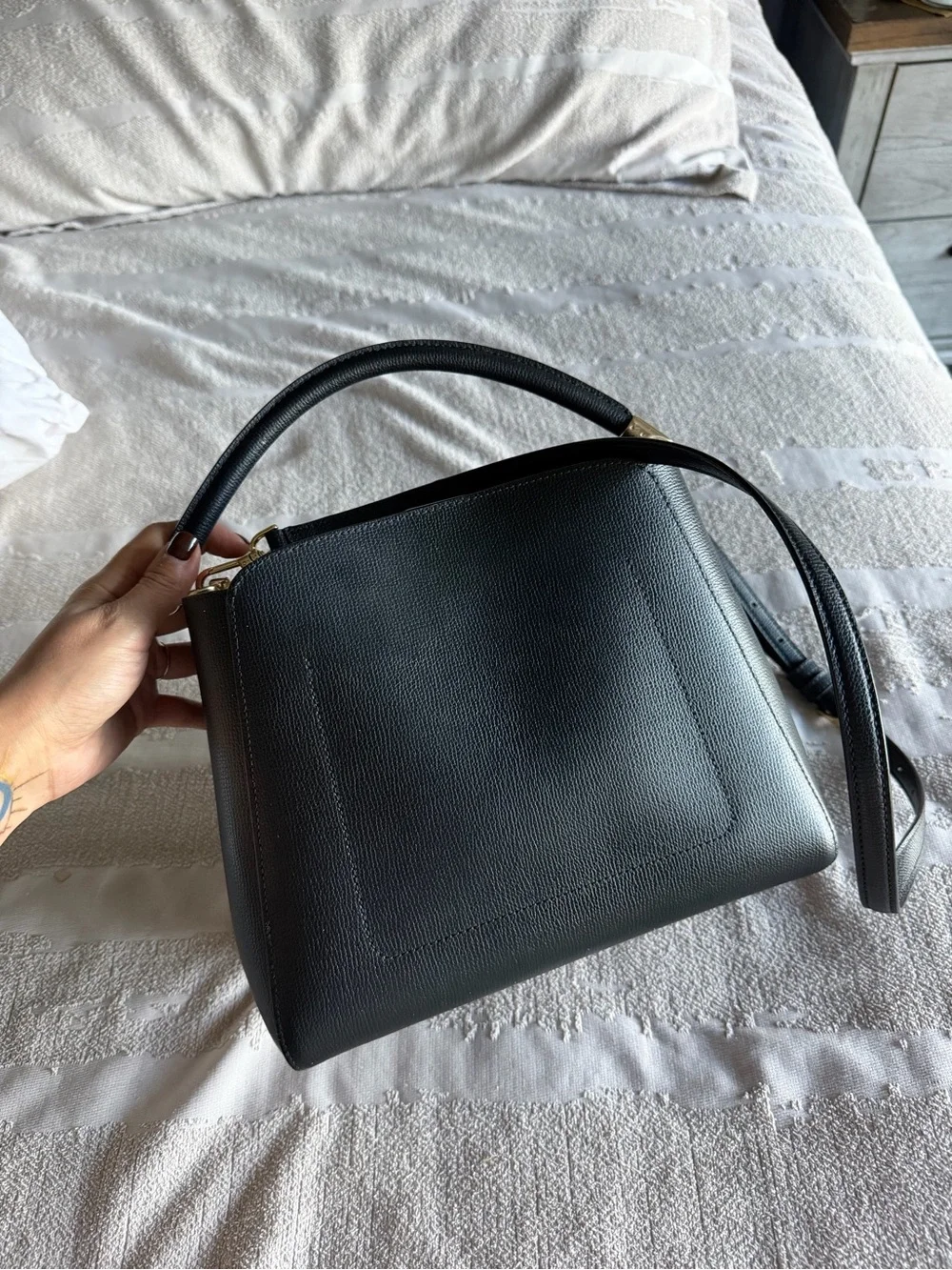 Kate Spade Phoebe black refined grain leather satchel with gold-tone hardware.
